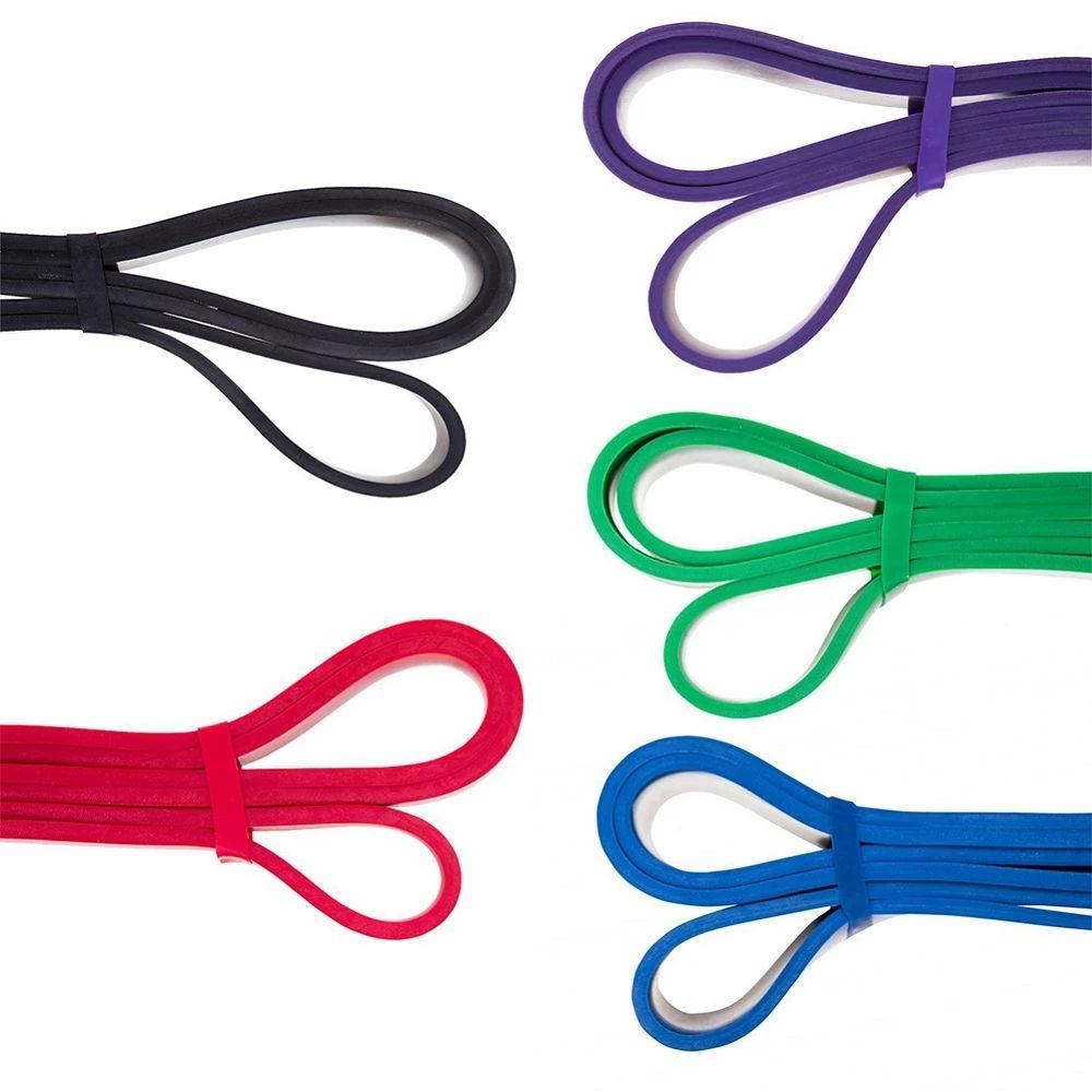 Set of colorful resistance bands in black, purple, green, red, and blue on a white background.